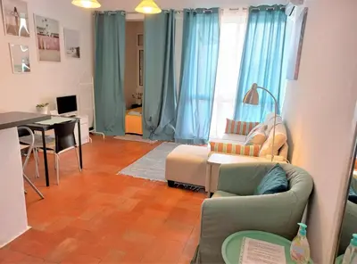 a living room with a couch and a table at Apartament near the ocean in Albufeira