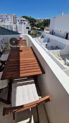 a table and chairs on the roof of a building at Praia Oura Sunset in Albufeira
