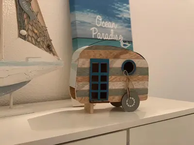 a wooden toy boat sitting on top of a counter at Apartamento 806 in Albufeira