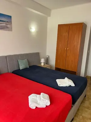 a bedroom with a bed with two white towels on it at Apartamento 806 in Albufeira