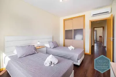 a hotel room with two beds with towels on them at Medronheira B2 - Dream Lodging in Albufeira