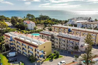 an overhead view of a building with the ocean in the background at Forte 303 - Dream Lodging in Albufeira