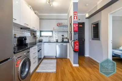 a large kitchen with a washer and dryer in it at Forte 303 - Dream Lodging in Albufeira