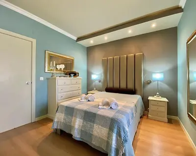 a bedroom with a bed with two towels on it at Tália X - Near the beach - Vilamoura in Vilamoura