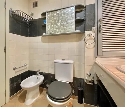 a bathroom with a toilet and a sink at Tália X - Near the beach - Vilamoura in Vilamoura