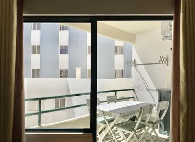 a balcony with a table and chairs in a room at Tália X - Near the beach - Vilamoura in Vilamoura