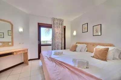 a bedroom with two beds and a window at Bellavista Avenida By BeGuest in Albufeira