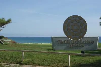 a sign with the ocean in the background at Villa Oceano Golf 482 2 Bedrooms Sea Views A Stone's Throw To The Beach in Vale do Lobo