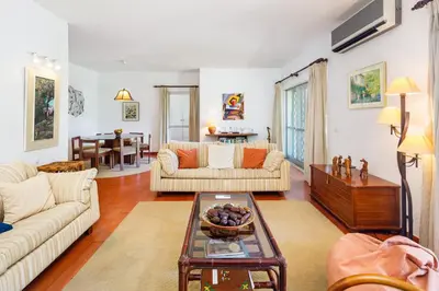 a living room with two couches and a table at Villa Quadradinhos 38Q 4 Bedrooms Private Pool Short Walk To The Beach in Vale do Lobo