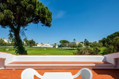 a white bench sitting on top of a building at Villa Quadradinhos 38Q 4 Bedrooms Private Pool Short Walk To The Beach in Vale do Lobo