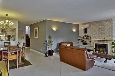 a living room with a couch and a dining room at Villa Quadradinhos 21Q 4 Bedroooms Private Pool Vale Do Lobo in Vale do Lobo