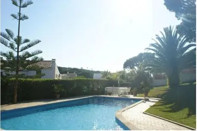 a swimming pool in a yard with trees and a house at Villa Quadradinhos 3Q 4 Bedrooms Private Pool Short Walk To The Praca in Vale do Lobo