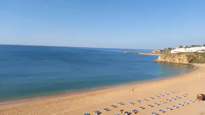 an aerial view of a beach with chairs and the ocean at Casa do Avô in Albufeira
