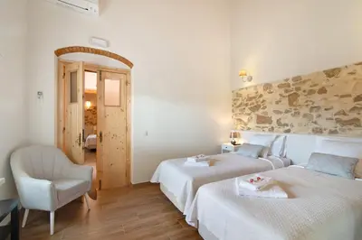a bedroom with two beds with towels on them at Villa Rodrigues Apartment I in Boliqueime