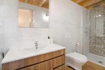 a bathroom with a toilet and a sink and a shower at Villa Rodrigues Apartment I in Boliqueime