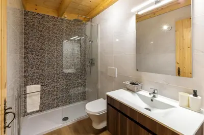 a bathroom with a sink and a toilet and a shower at Villa Rodrigues in Boliqueime