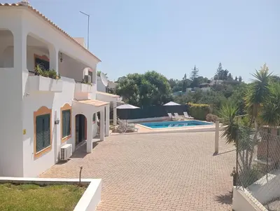 a view of a house with a swimming pool at Villa Núria in Loulé