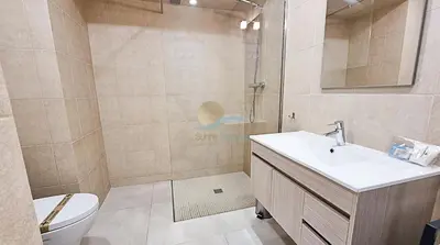 a bathroom with a shower and a sink and a toilet at Alta Oura Prime by Sunny Deluxe in Albufeira