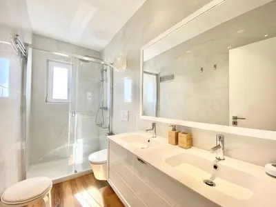a bathroom with a shower and a sink and a toilet at Mira Marina - Vilamoura in Vilamoura