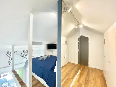a room with a bed and a glass wall at Mira Marina - Vilamoura in Vilamoura
