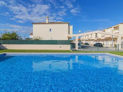 a large swimming pool in front of a building at Holiday Home Bela Vitta by Interhome in Ferreiras