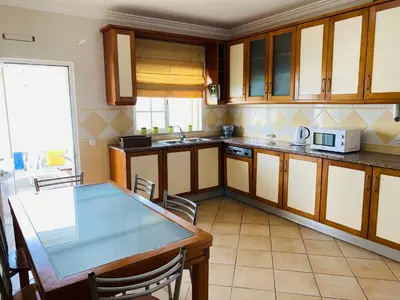 a room with a table and chairs and paintings at Rafael by Check-in Portugal in Albufeira
