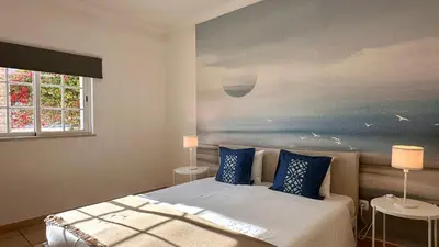 a living room with two couches and a table at Rafael by Check-in Portugal in Albufeira