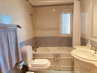 a bathroom with a tub and a toilet and a sink at Vista by Check-in Portugal in Albufeira