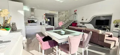 a kitchen and living room with a table and chairs at Villa Modern Design in Albufeira