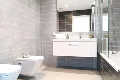 a bathroom with a toilet and a sink and a mirror at Villa Modern Design in Albufeira