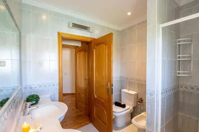 a bathroom with a sink and a toilet at Villa Samoa by Algarve Vacation in Albufeira