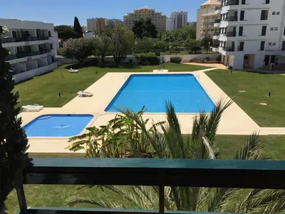 a view of a swimming pool from a building at Tossan House in Vilamoura Downtown in Quarteira