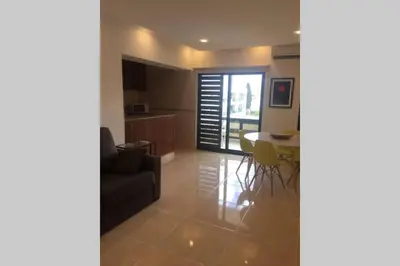 a living room with a couch and a table at Marina Mar in Vilamoura downtown in Quarteira