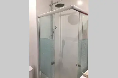 a shower with a glass door in a bathroom at Marina Mar in Vilamoura downtown in Quarteira