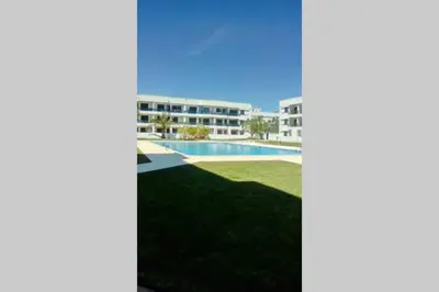 a view of the courtyard of a apartment building with a swimming pool at Marina Mar in Vilamoura downtown in Quarteira