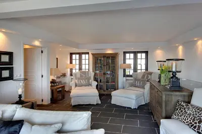 a living room with white furniture and white chairs at Casa Latino - Oceanfront - Luxury & Charming villa- Jacuzzi at Rooftop by DreamvillasAlbufeira in Albufeira
