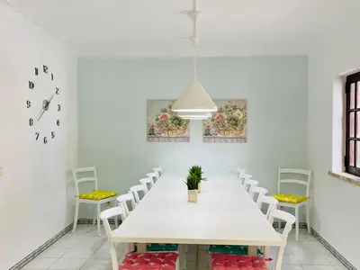 a white dining room with a white table and chairs at Azinheira by Check-in Portugal in Albufeira