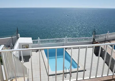 a balcony of a cruise ship with a swimming pool at Apartamentos Encosta do Mar in Albufeira