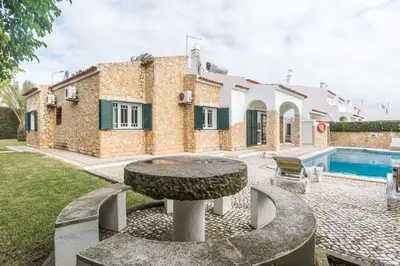 a villa with a swimming pool and a house at Oura Villa V3 com Piscina Privada in Albufeira