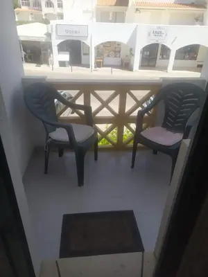 two chairs and a table on a balcony at Rêve au Soleil in Albufeira