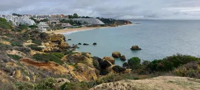 a view of a beach with rocks in the water at Rêve au Soleil in Albufeira