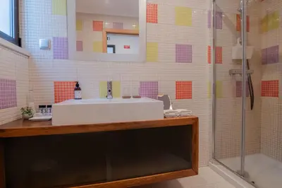 a bathroom with a sink and a shower at Coastal Retreat with Pool and Beach Access by Drago Rentals in Albufeira