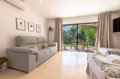a dining room with a glass table and chairs at Seacoast Retreat with Pool and Beach Access by Drago Rentals in Albufeira