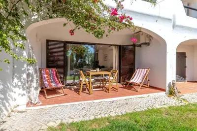 a swimming pool with blue water in a resort at Seacoast Retreat with Pool and Beach Access by Drago Rentals in Albufeira