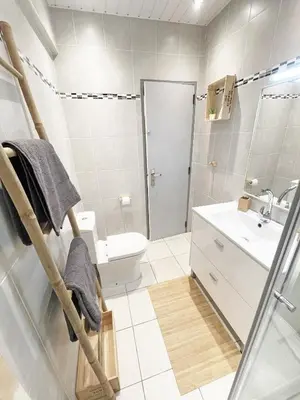 a bathroom with a shower and a toilet and a sink at Beachfront Oura - 100m Beach, Seaview, Garage, 300m Strip in Albufeira