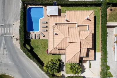 an aerial view of a house with a swimming pool at Villa Tulipa in Albufeira