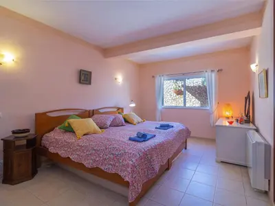 a bedroom with a bed and a window at Villa Villa Rosa by Interhome in Loulé