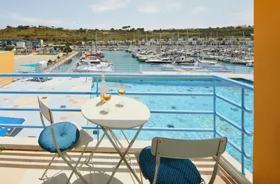 a balcony with a view of a marina at Casas Barulho Albufeira Marina in Albufeira