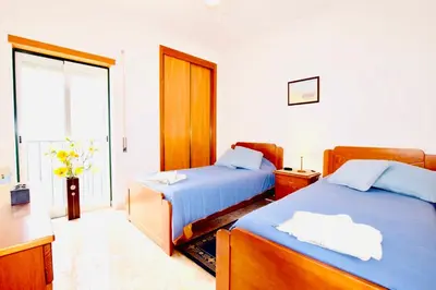 a hotel room with two beds and a window at Estrada de, Urbanizacao,edificio laranjal,apartment 18,vale carro, 8200-596 in Albufeira