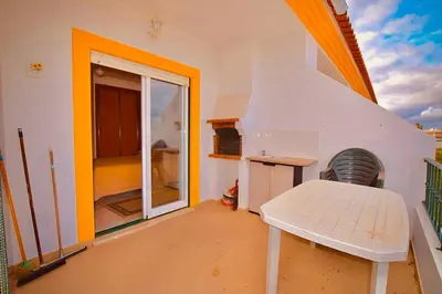 a room with a table and a bench on a balcony at Estrada de, Urbanizacao,edificio laranjal,apartment 18,vale carro, 8200-596 in Albufeira